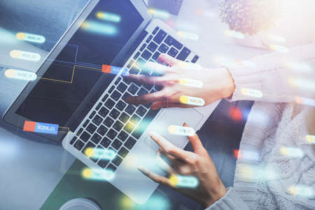Double exposure of woman hands working on computer and data theme hologram drawing. Top View. Technology concept.の写真素材