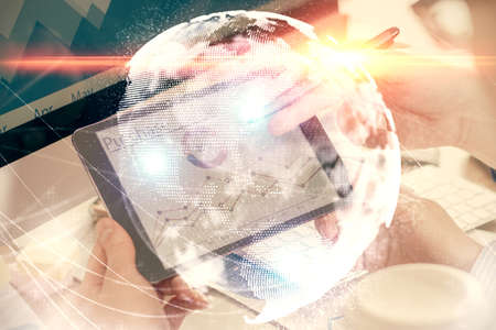 Double exposure of mans hands holding and using a phone and international business theme drawing.