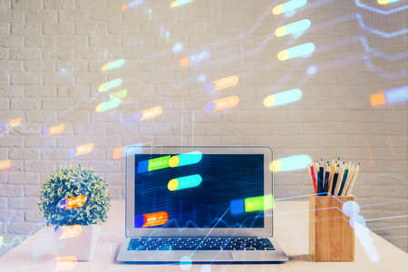 Double exposure of table with computer on background and data theme hologram. Data technology concept.の写真素材