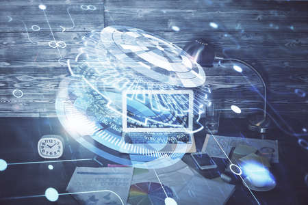 Double exposure of laptop computer and technology theme hologram. Concept of freelance work.の写真素材