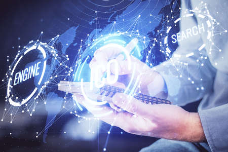 Mans hands working with notes background. Cryptocurrency and finance concept. Double exposure.