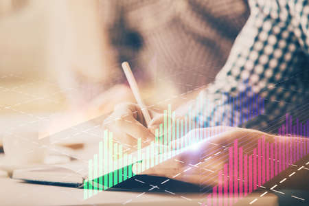 Multi exposure of two men planing investment with stock market forex chart background. Concept of...