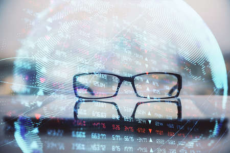 Business theme hologram with glasses on the table background. Concept of search. Double exposure.