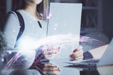 Social network theme hologram over hands taking notes background. Concept of global international...