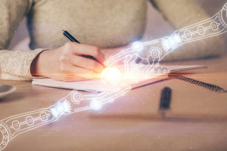 Double exposure of writing hand on background with data technology hologram. Big data concept.の写真素材