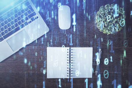 Double exposure of data theme drawing hologram over topview work table background with computer. Concept of technology.の写真素材