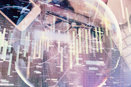 Double exposure of business theme hologram over desktop with phone. Top view. Mobile international...