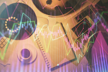 Multi exposure of forex chart drawing and work table top veiw. Concept of financial analysis.
