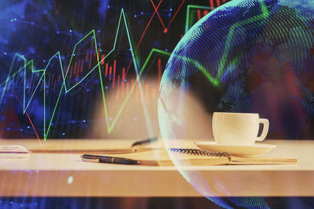 Multi exposure of forex graph drawing and desktop with coffee and items on table background. Concept...