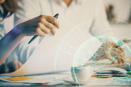 Double exposure of social network theme drawing over people taking notes background. Concept of...