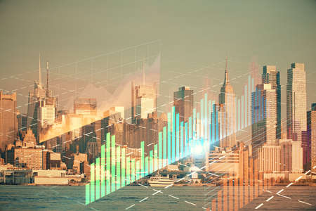 Forex graph on city view with skyscrapers background double exposure. Financial analysis concept.の写真素材