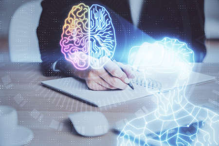 AR hologram over womans hands taking notes background. Concept of augmented reality. Multi exposureの写真素材