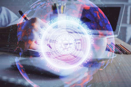 Tech theme hologram over womans hands taking notes background. Concept of hightech. Double exposureの写真素材