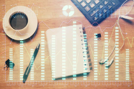 Multi exposure of forex chart drawing and work table top view. Concept of financial analysis.の写真素材