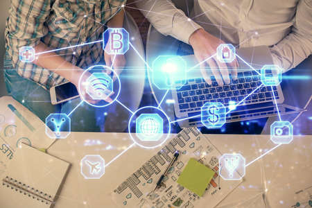 Double exposure of man and woman working together and social network theme hologram drawing....