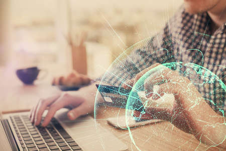Double exposure of man hands holding a credit card and social network theme drawing. Digital finance...