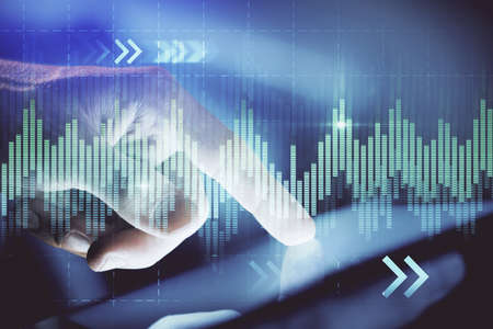 Multi exposure of mans hands holding and using a phone and financial chart drawing. Market analysis...
