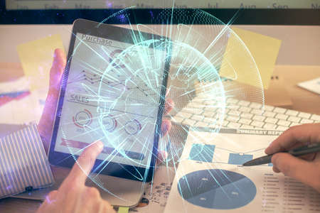 Double exposure of mans hands holding and using a phone and international business theme drawing.