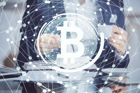Mans hands working with notes background. Cryptocurrency and finance concept. Double exposure.の写真素材