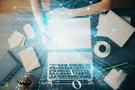 Multi exposure of writing hands on background with data solution hologram. Technology concept.
