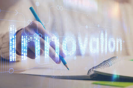 Double exposure of womans hands on background with technology and digital coding icons. Data development concept. Close up.の写真素材