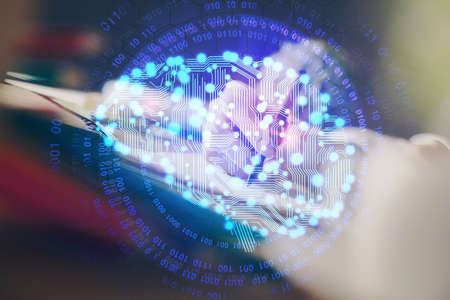 Multi exposure of writing hand on background with brain hologram. Concept of self learning.