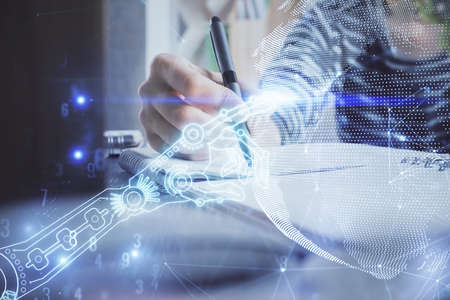 Tech theme hologram over womans hands taking notes background. Concept of hightech. Double exposureの写真素材