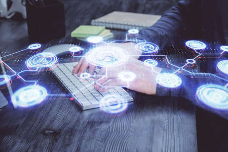 Media network theme hologram with man working on computer on background. Concept of internet communication. Double exposure.の写真素材