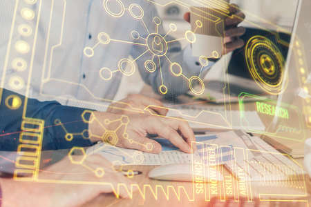Double exposure of technology hologram with man working on computer background. Concept of big data.