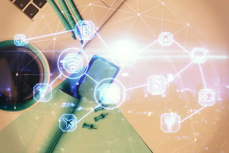 Social network hologram drawings over computer on the desktop background. Top view. Multi exposure. Concept of people connection.の写真素材