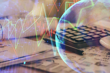 Double exposure of financial chart drawings and desk with open notebook background. Concept of forex marketの写真素材