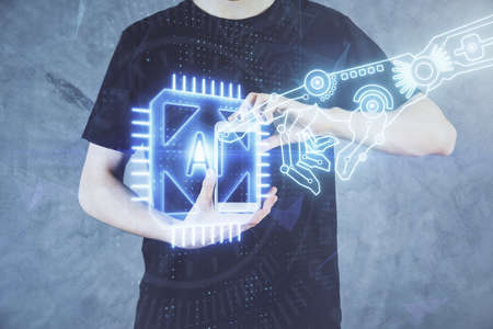 Double exposure of mans hand holding and using a digital device and data theme hologram drawing. Technology concept.の写真素材
