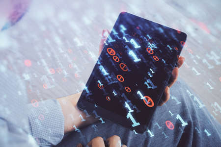 Double exposure of mans hand holding and using a digital device and data theme drawing. Technology concept.の写真素材