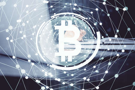 Mans hands working with notes background. Cryptocurrency and finance concept. Double exposure.の写真素材