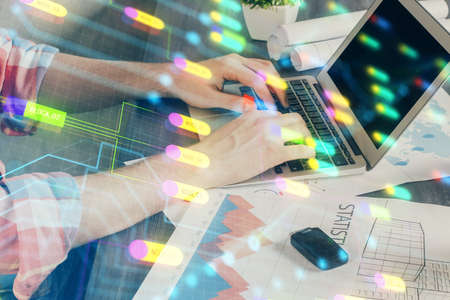 Multi exposure of technology hologram with man working on computer background. Concept of big data.