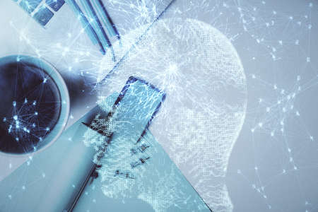 Multi exposure of brain sketch hologram over topview work table background with computer. Concept of...