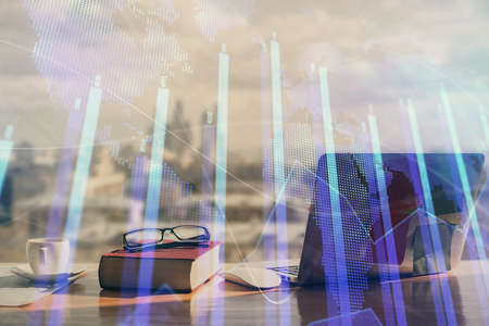 Double exposure of financial chart drawings and desk with open notebook background. Concept of forex...