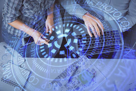 Double exposure of man and woman working together and data theme hologram drawing. Computer...