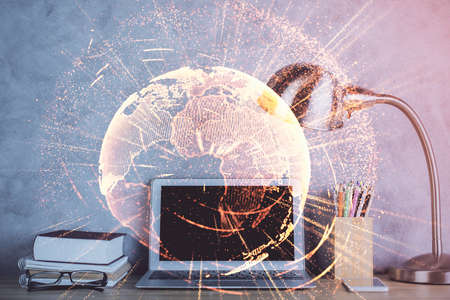 Computer on desktop with social network hologram. Double exposure. Concept of international people connections.の写真素材
