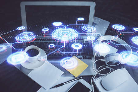 Computer on desktop with social network hologram. Double exposure. Concept of international people...