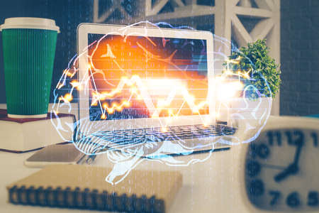 Double exposure of work space with computer and human brain drawing hologram. Brainstorm concept.
