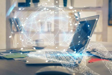 Computer on desktop with social network theme icon. Multi exposure. Concept of international...