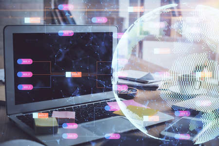 Multi exposure of table with computer and world map hologram. International data network concept.