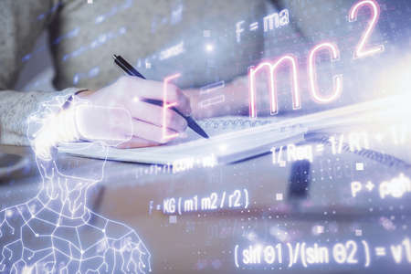 Science formula hologram over womans hands taking notes background. Concept of study. Multi exposure
