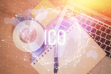 Blockchain theme hologram drawings over computer on the desktop background. Top view. Multi exposure. Concept of cryptoeconomy.の写真素材