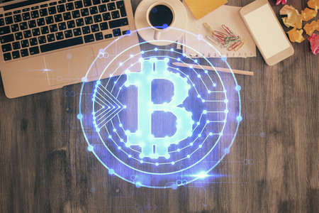 Blockchain theme hologram drawings over computer on the desktop background. Top view. Double exposure.の写真素材