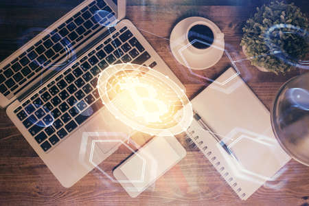 Blockchain theme hologram drawings over computer on the desktop background. Top view. Double exposure.の写真素材