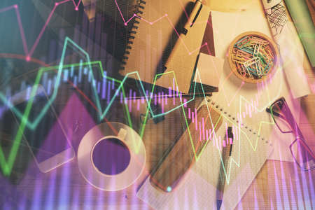 Double exposure of forex graph drawing and work table top veiw. Concept of financial analysis.の写真素材