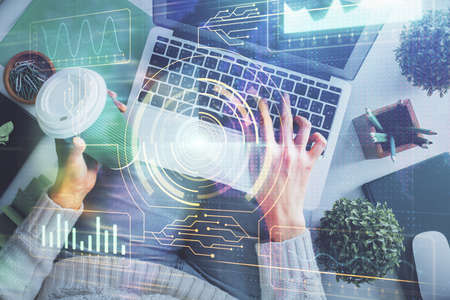Double exposure of woman hands working on computer and data theme hologram drawing. Top View....