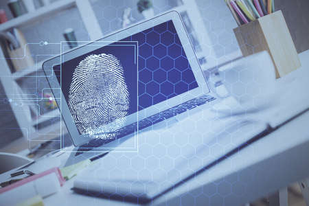 Computer on desktop in office with finger print drawing. Double exposure. Concept of business data...